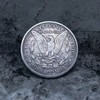Cthulhu skull tentacle coin pendant reversed to show the Morgan Dollar eagle with United States of America and One Dollar inscription, in a four-prong open bezel