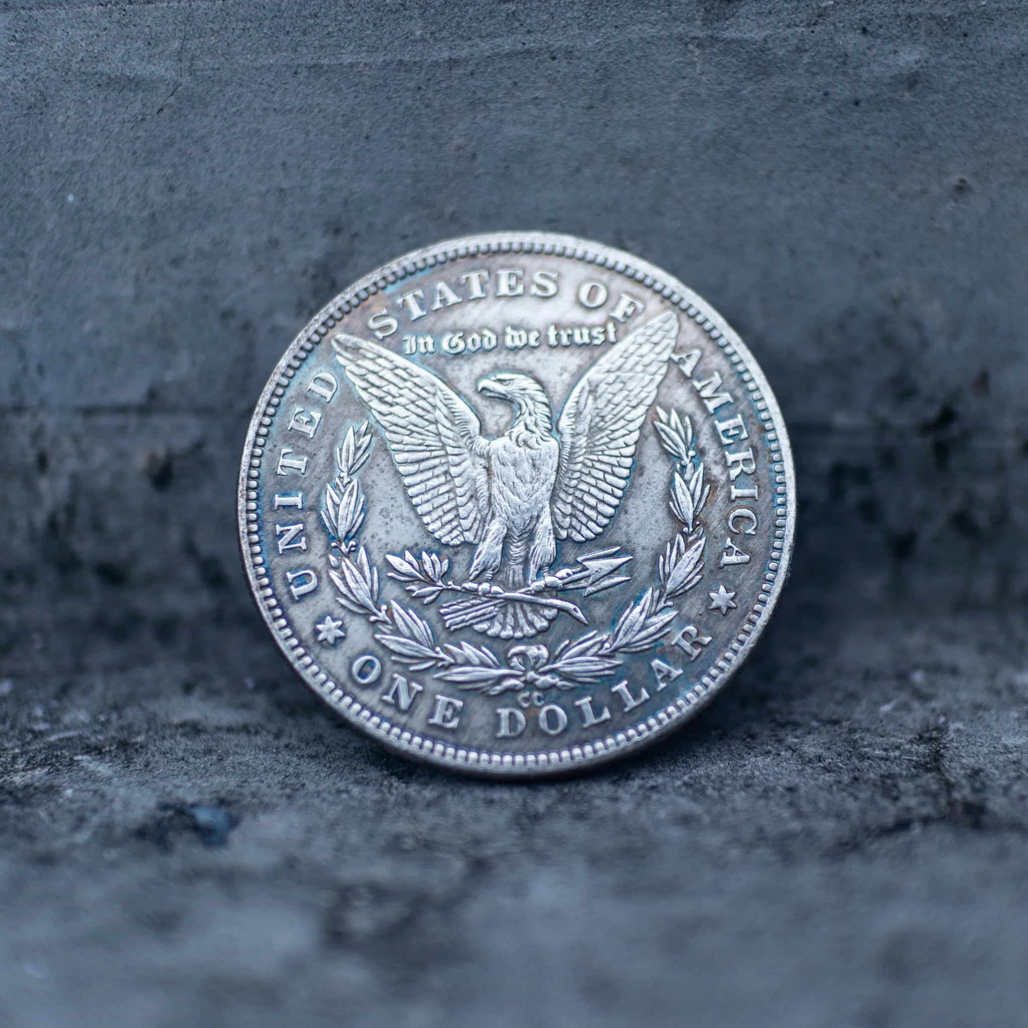 Morgan Dollar reverse with American eagle, In God We Trust inscription, and One Dollar denomination, reverse side of the Evil Queen witch coin