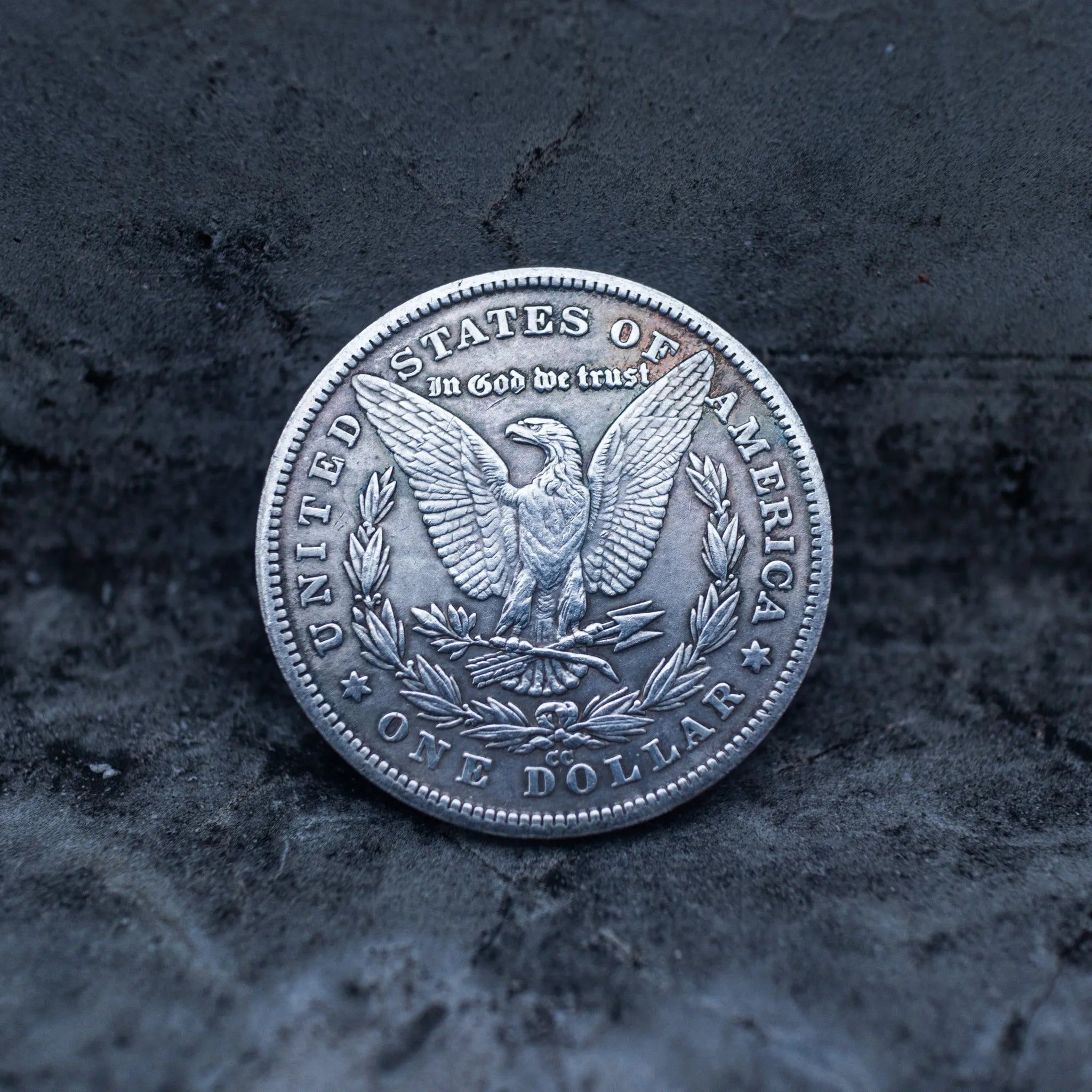 Morgan Dollar reverse with American eagle, In God We Trust inscription, United States of America border, and One Dollar denomination