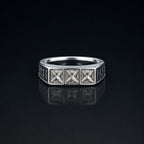 Rune Triple-Stone Signet Ring with three square white crystal stones on a reflective black background