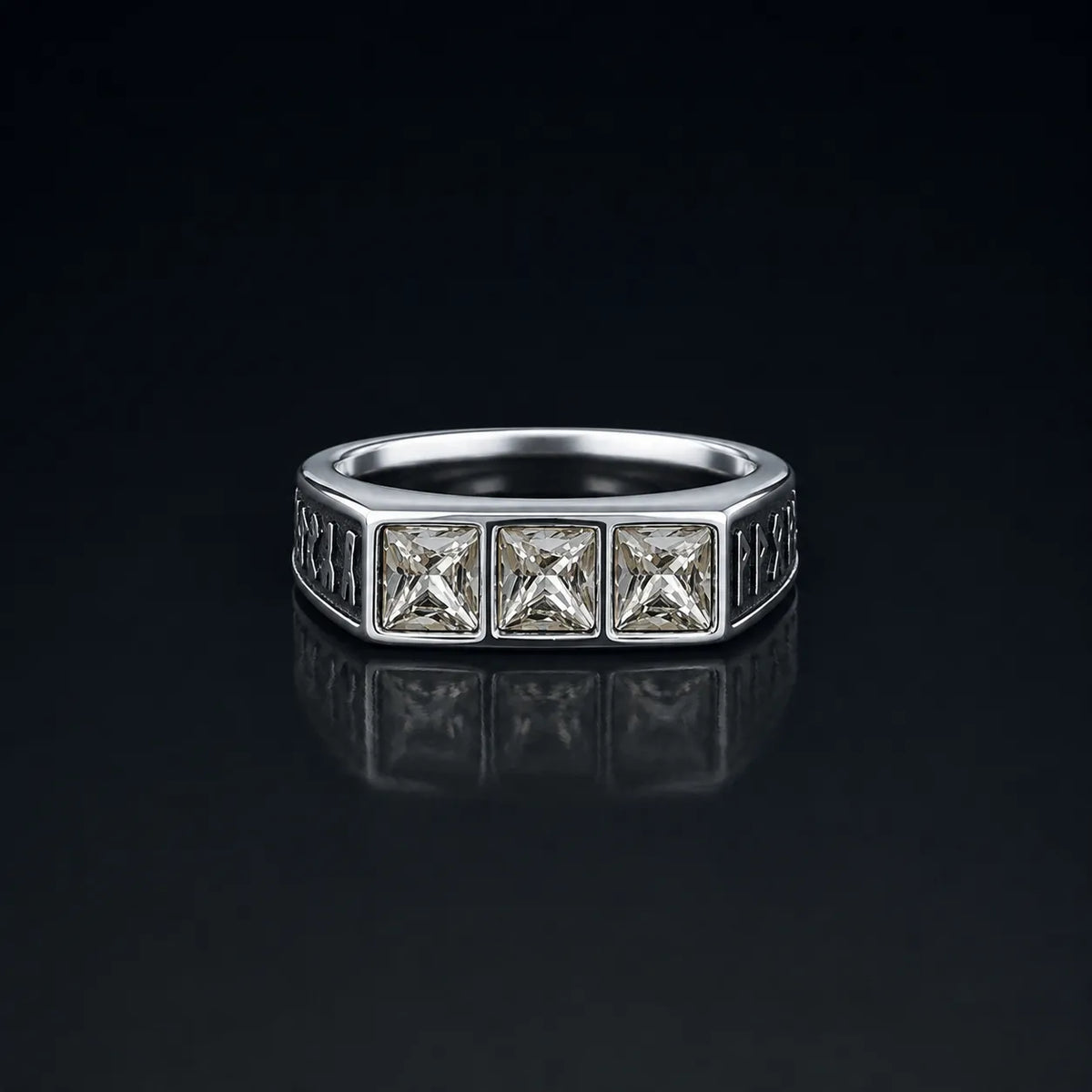 Rune Triple-Stone Signet Ring with three square white crystal stones on a reflective black background