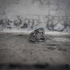 Saint Benedict medal ring side view showing openwork band and reverse medallion engraving, dark aesthetic stainless steel jewelry by Veilhinge