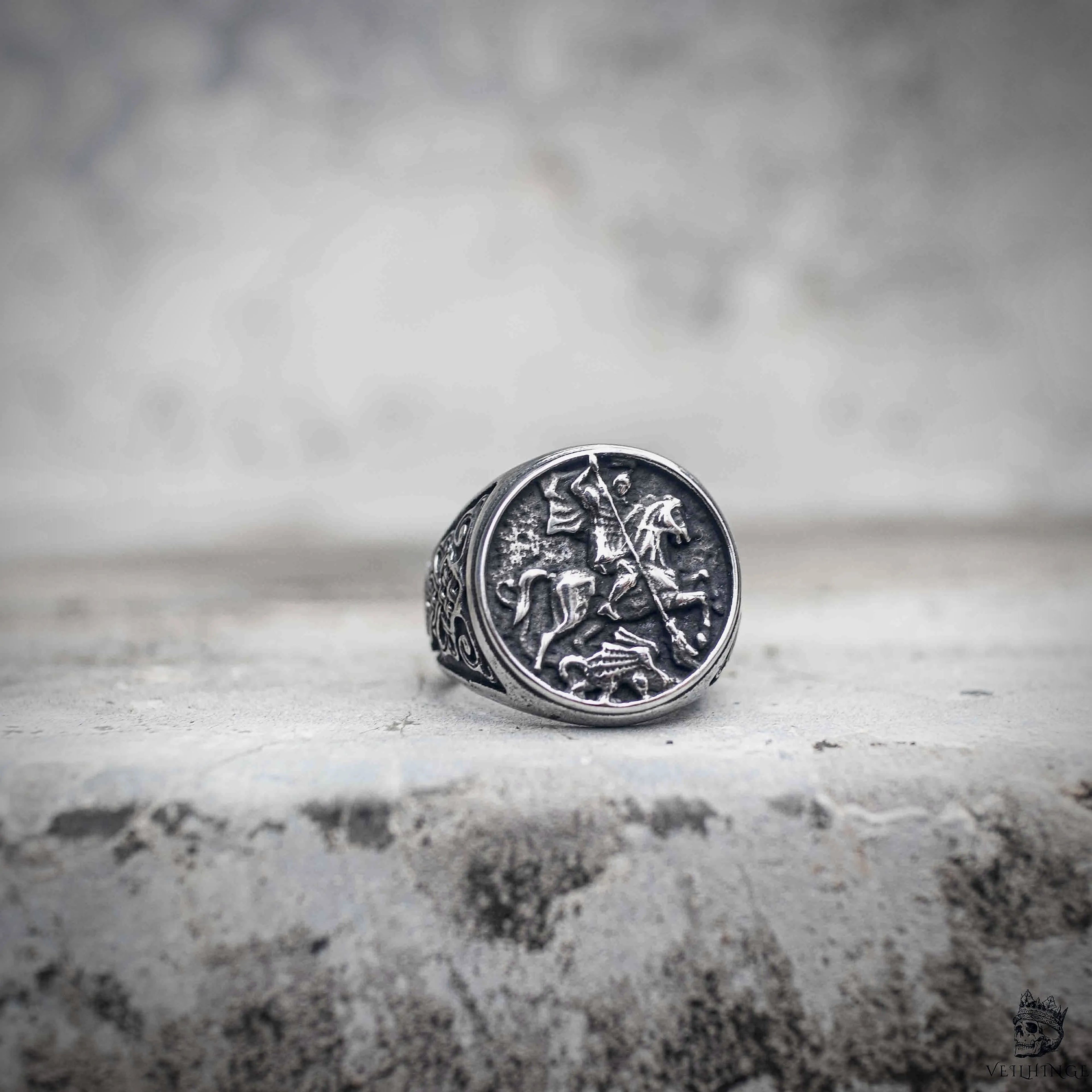 Saint George dragon slayer signet ring with knight on horseback coin engraving in oxidized antique silver stainless steel, medieval dark aesthetic ring by Veilhinge, front view