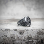 Saint George signet ring side view showing gothic cross and Celtic scroll engraving on band, oxidized antique silver medieval stainless steel ring by Veilhinge