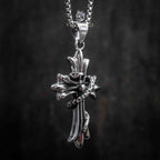 gothic cross pendant with serpent coiled around the shaft — full chain view on dark background