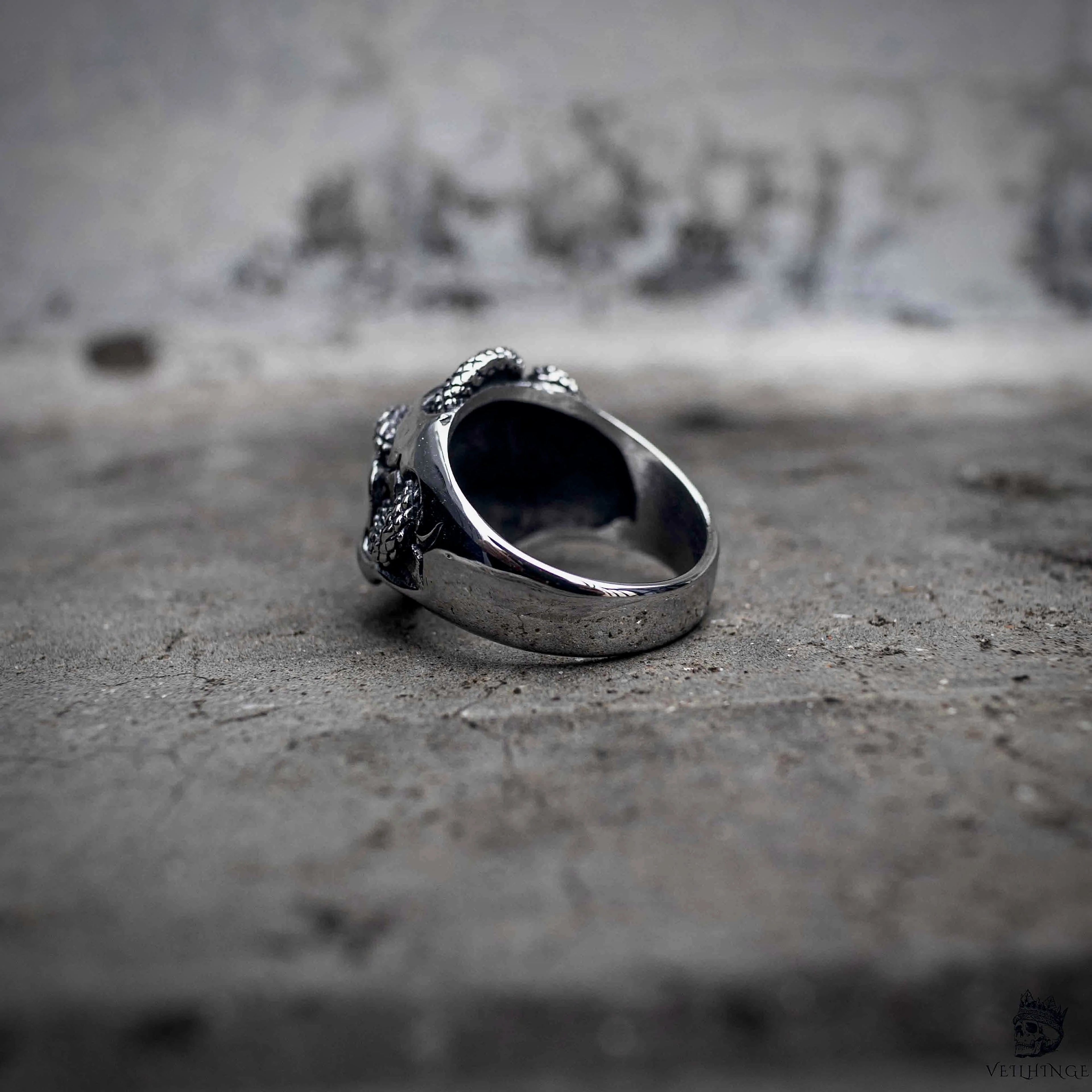 Serpent skull ring side view showing polished wide band and interior, gothic dark aesthetic stainless steel ring by Veilhinge