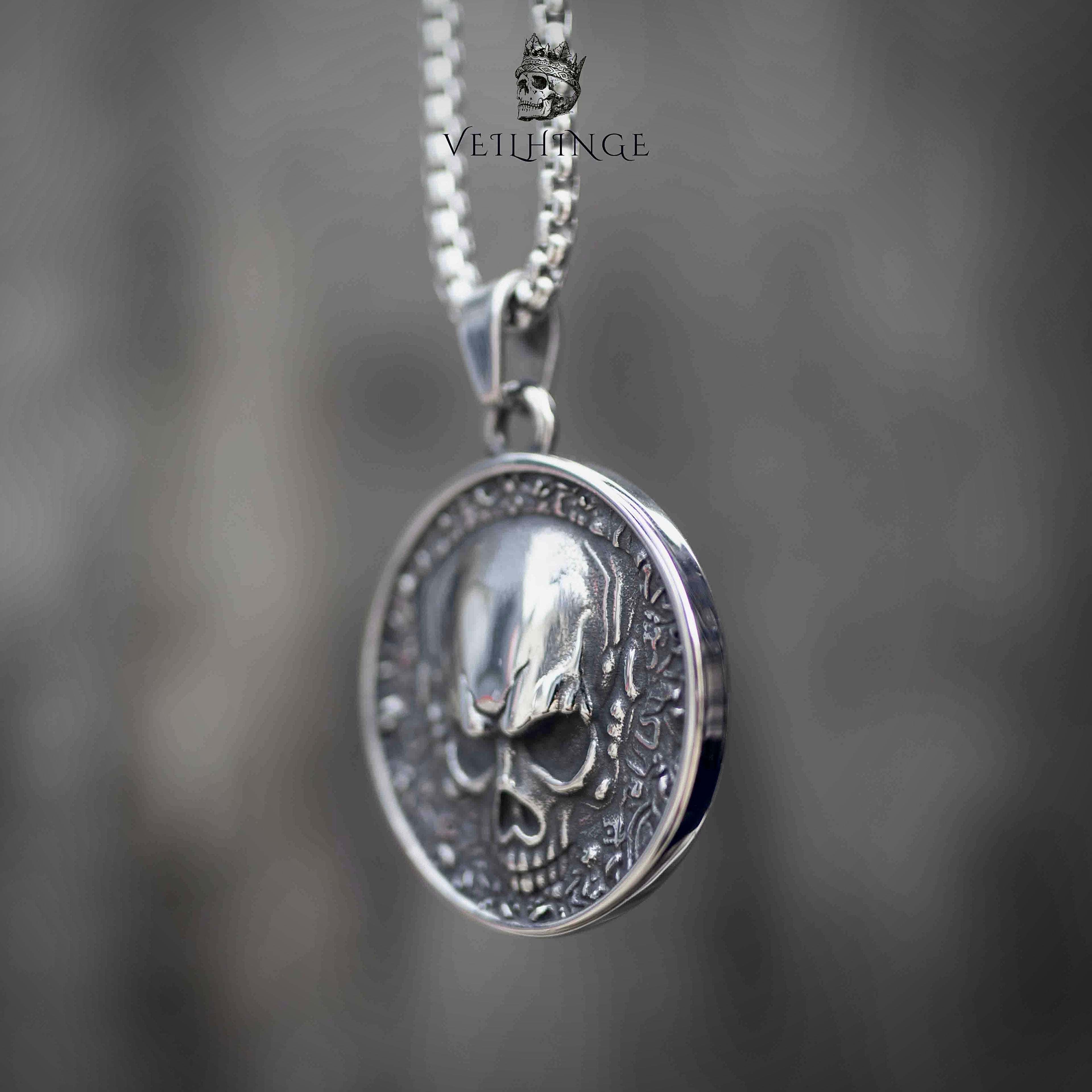 Skull coin pendant necklace side angle view, three-dimensional skull relief, oxidized silver, gothic statement necklace