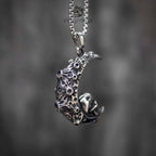 Skull crescent moon pendant necklace front angle, intricate filigree crescent with skull detail, oxidized silver, gothic dark aesthetic necklace
