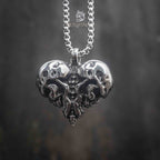 skull heart pendant on full box chain — black and white editorial shot showing pendant scale and chain length