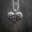 skull heart pendant on full box chain — black and white editorial shot showing pendant scale and chain length