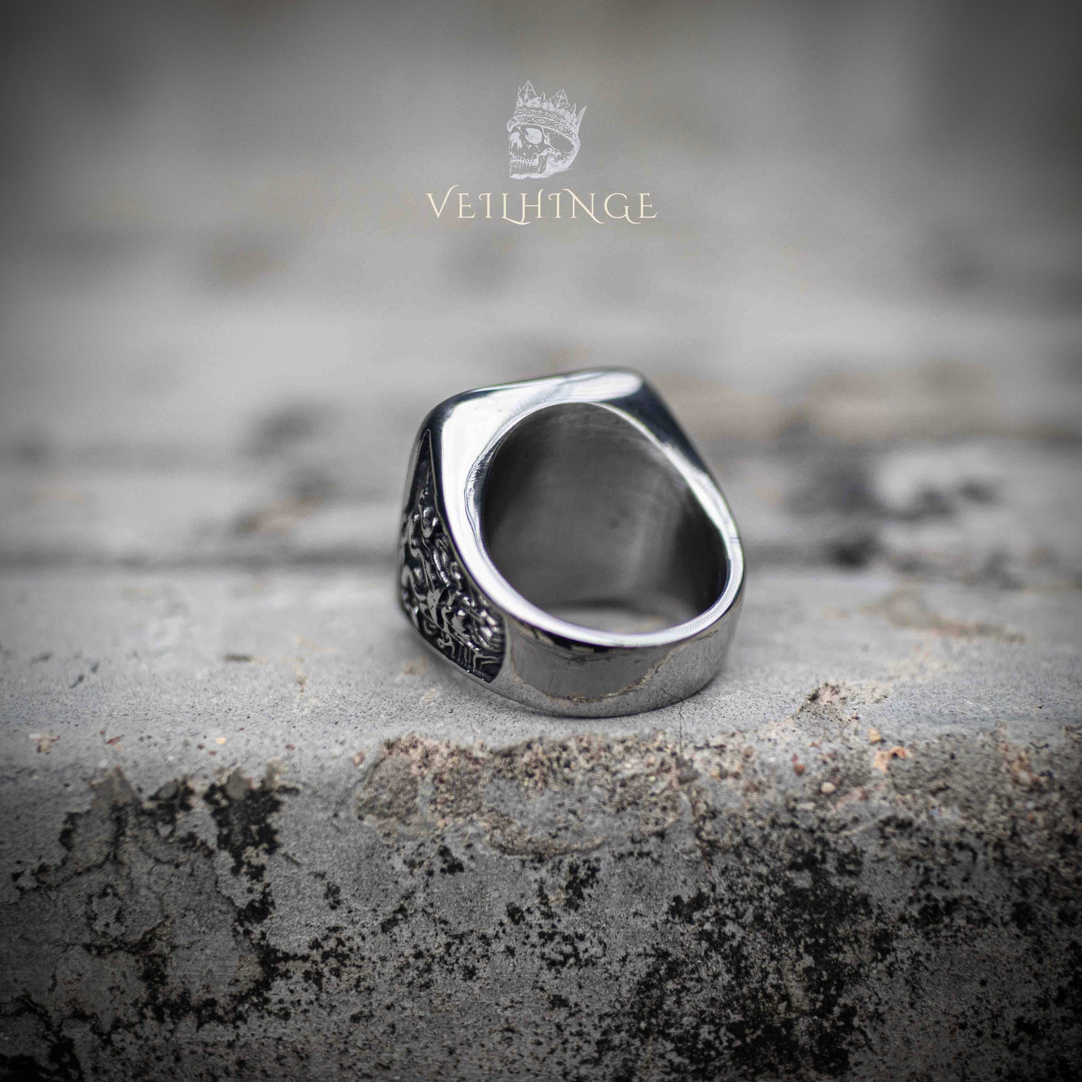 Side profile of skull and tentacle signet ring showing tapered band construction and smooth polished inner surface — substantial gothic ring on stone