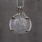 Coin pendant reversed to show a skull wearing Queen Victoria's mourning veil, Victoria Dei Gra Britt Regina inscription around the border, in a four-prong bezel