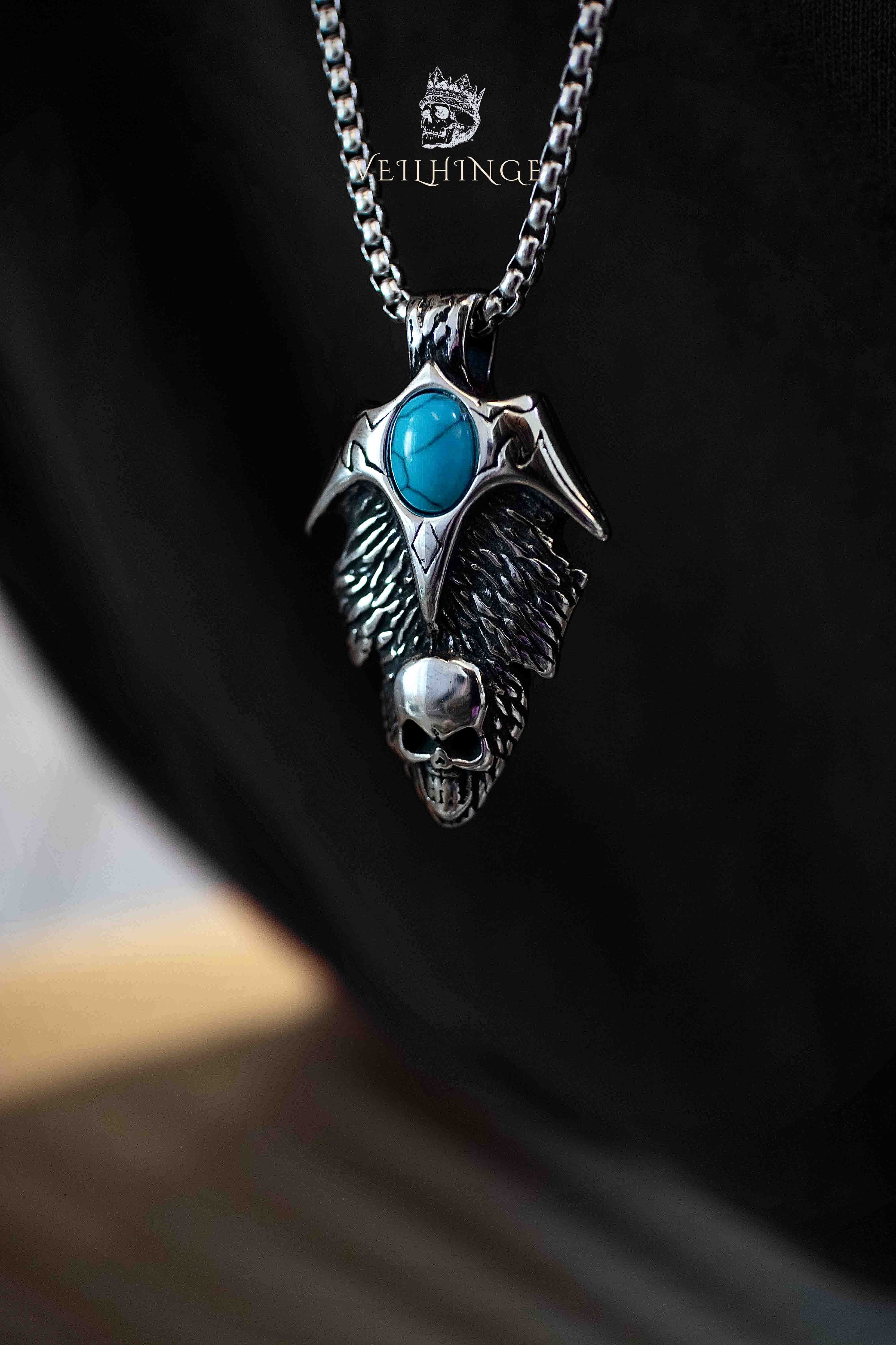 Wing cross pendant necklace back view worn on model, gothic cross with feathered wings, oxidized silver, dark aesthetic alternative jewelry