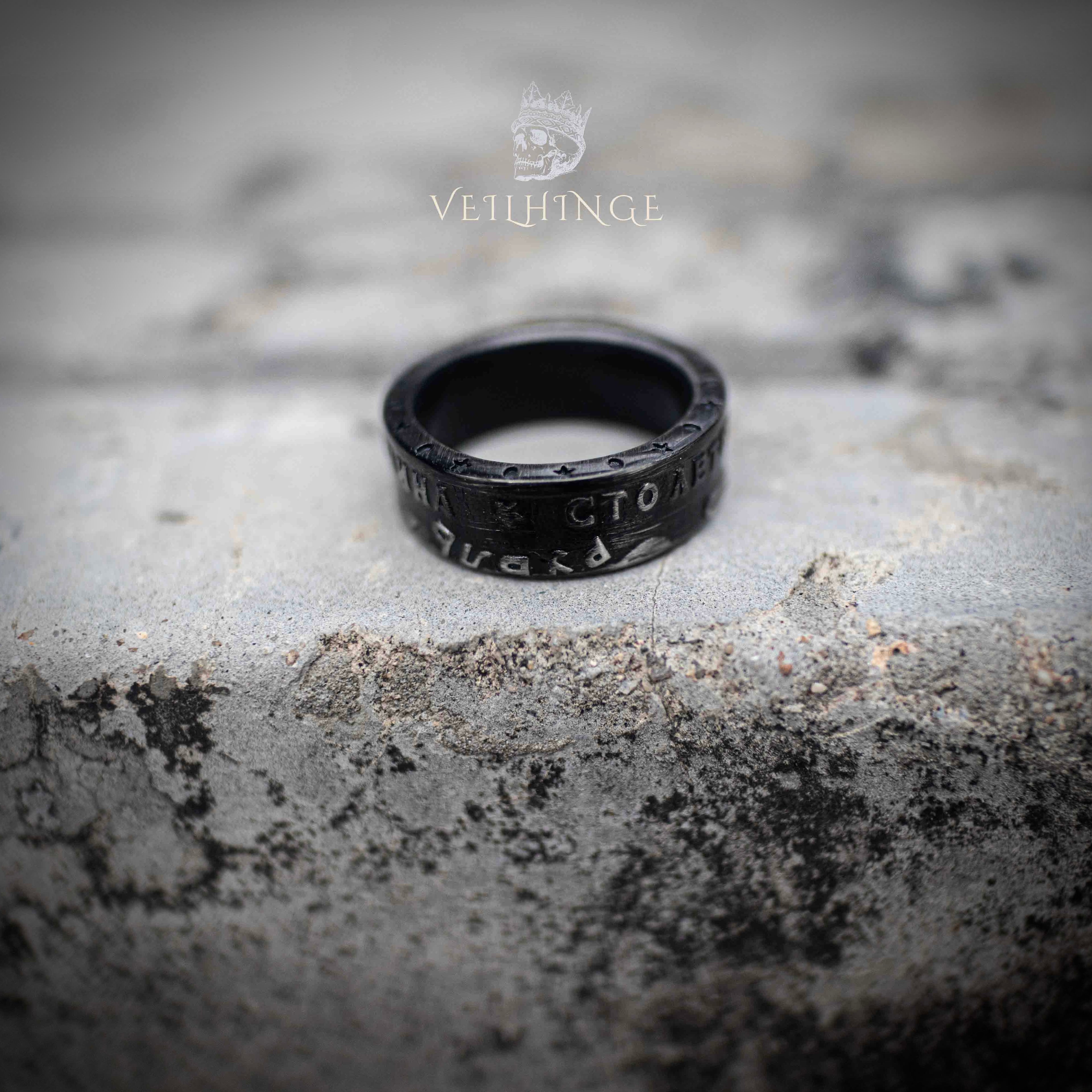 Front view of USSR commemorative coin ring with Cyrillic centenary inscription — oxidized black band, raised Soviet-era lettering on stone