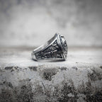 Spartan signet ring side view showing battle axe and laurel wreath engraving on band, oxidized stainless steel medieval warrior ring by Veilhinge