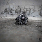 Spartan warrior signet ring with Spartan helmet engraving and Virtutis Fortuna Comes Latin inscription, oxidized antique silver stainless steel, medieval dark aesthetic ring by Veilhinge, front view