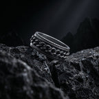 stainless steel chain spinner ring rotating band detail place on dark rock