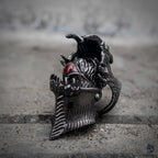 Gothic demon eye articulated ring close-up showing fang jaw mechanism and hidden eye detail in oxidized black stainless steel, dark aesthetic statement ring by Veilhinge, angled view
