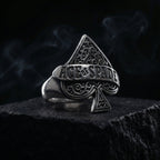 ace of spades gothic ring close-up with dark smoke background