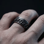 roman numeral spinner ring with rotating chain worn on finger