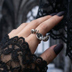 Veilhinge Gothic Cat Poison Ring worn on hand with black lace sleeve, openable storage ring