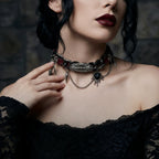 Woman wearing a gothic-style necklace with dark makeup, dark gothic style
