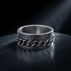 stainless steel spinner ring with roman numerals and chain detail
