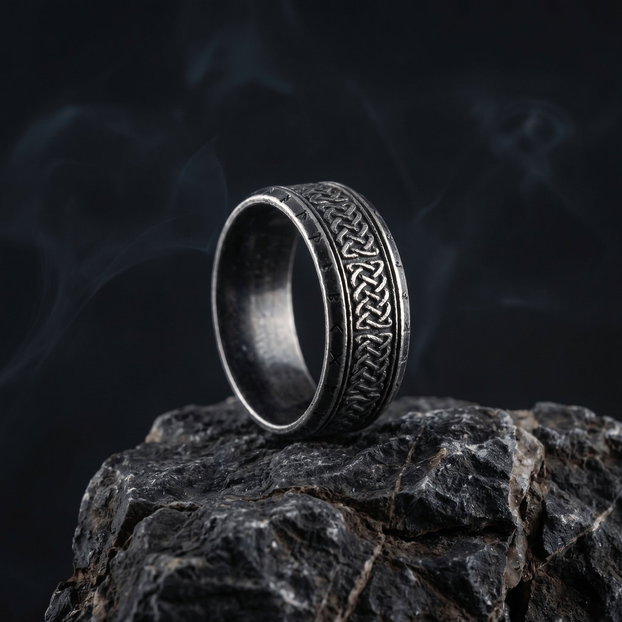 nordic woven ring stainless steel band with rune engraving dark minimal style
