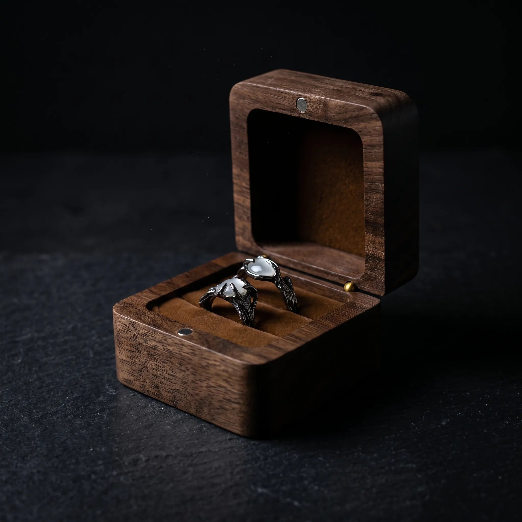 Gothic claw ring with moonstone set in dark stainless steel, presented in a walnut wood jewelry box — Veilhinge dark luxury gothic ring