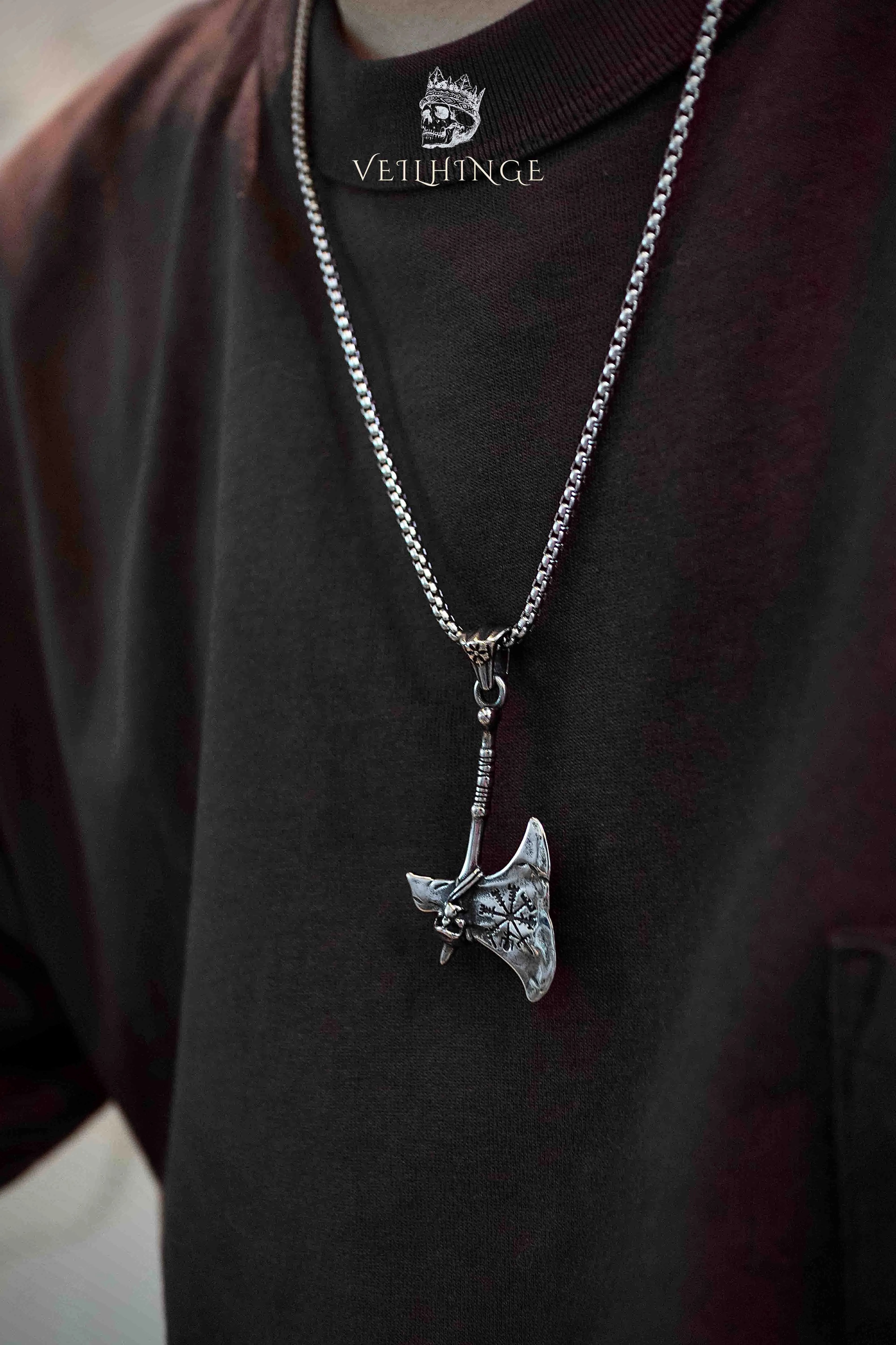 Viking battle axe pendant necklace worn on model with dark outfit, Vegvisir compass axe pendant, oxidized silver, Norse dark aesthetic statement necklace