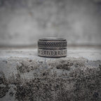Viking spinner ring with Celtic knot upper band and Elder Futhark rune lower band in oxidized antique silver stainless steel, Norse anxiety fidget ring by Veilhinge, front view