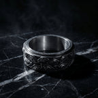 stainless steel spinner ring with engraved evil eye pattern